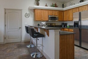 Full kitchen with sit at bar