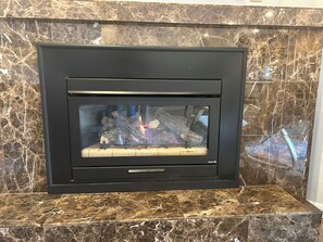 Gas fireplace in living room. 