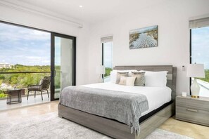 Bedroom 2 also with a plush queen bed & access to a private terrace & ensuite bathroom