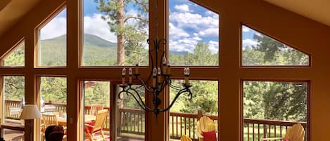 Great room to the back deck overlooking the meadow and the foothills. 