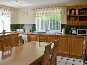 Well equipped kitchen/ dining room | Fairways Cottage, Belford, near Bambugh
