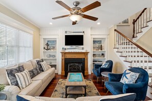 Open concept living space with plenty of seating to entertain friends and family.