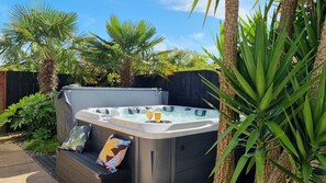 5 seater spa with massage jets, built-in bluetooth speakers and LED lights