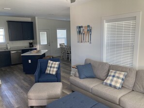 Main living area.  Full size couch, 2 chairs and multiple ottoman options.