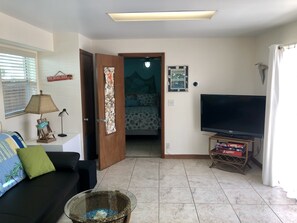 Living room/kitchen looking into the bedroom.