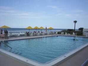 Lovely OCEANfront pool offers sundeck with loungers, sun umbrellas & tables