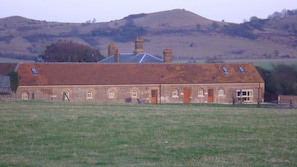 View of the cottages with the Chilterns behind