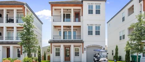 Gorgeous, Clean Exterior with 2 Balconies and 6 Passenger Golf Cart.