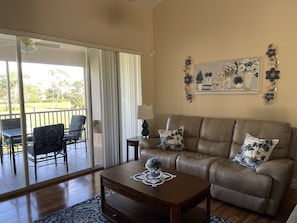 Relax in the living room overlooking the 5th green. 