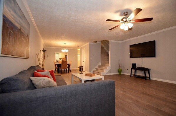 Modern looking living room with brand new flooring.