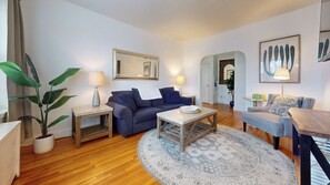 Comfortable sofa, coffee table, wall art, accent lights 