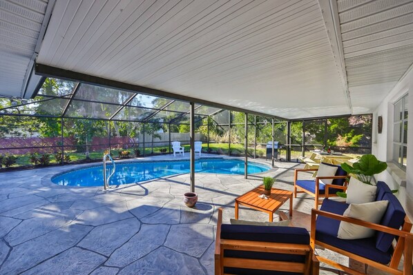 Private pool with sitting area and large picnic table for dining al fresco