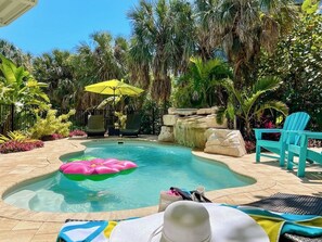 The heated pool with waterfall is as refreshing as it is serene.