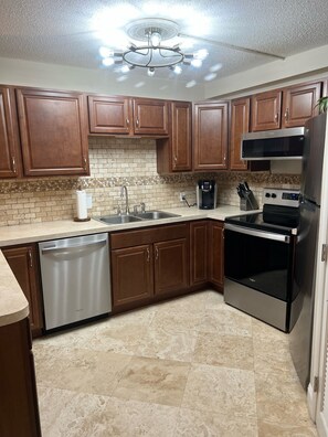 Kitchen with new stainless steel appliances Sept 2022