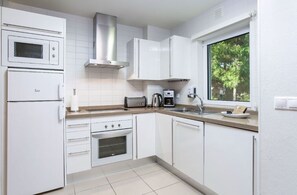 Streamlined kitchen with modern amenities.