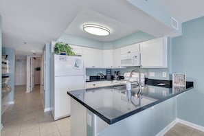 Beautifully Updated Kitchen with Granite Countertops and views of the Gulf