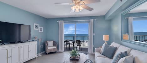 Spacious Living Room with views of the Beautiful Gulf of Mexico and access to Private Balcony and Full Size Sleeper Sofa