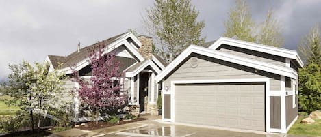 Front of house with 2 car parking garage and 2 additional space on front drive.