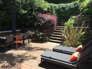Soak up the rays or work outside in our private garden like deck