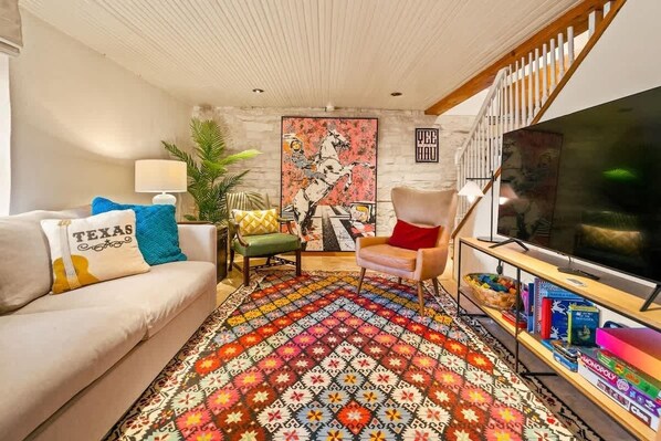 The living room: a time capsule of elegance with a modern twist – where a sizable TV brings stories to life against a backdrop of history