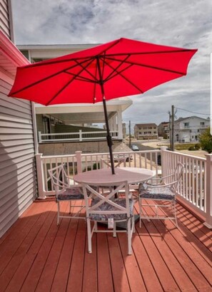 Deck view toward the ocean, entrance to beach is visible.