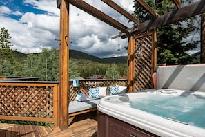 Let your worries bubble away in the private hot tub with Continental Divide views