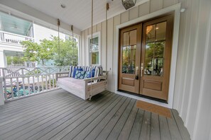 Amazing front porch swing to relax on after a long day at the beach 