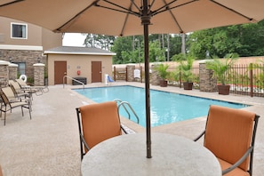 Relax by the shared outdoor pool.