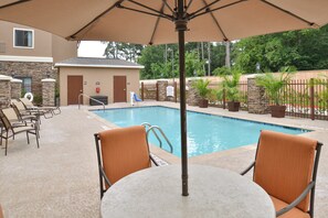 Relax by the shared outdoor pool.