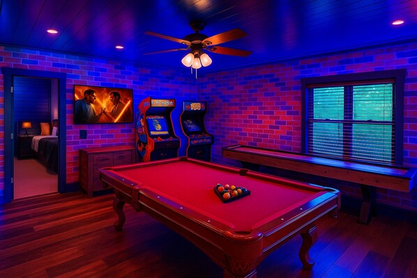 Epic Game Room with 3 Arcades (1200 Games Pandora's Box, Time Crisis Shoot Out, & a Classic 80's Arcade). A brand new Shuffleboard Table, Billiards table, Darts, Cornhole, Ring Swing, and a Roku TV with streaming services. The fun is ENDLESS!