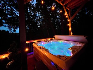 Enjoy the new hot tub on the lower level  with the fire pit nearby.