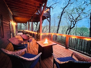 Cozy propane Firepit on the bottom level to enjoy s’more’s at.