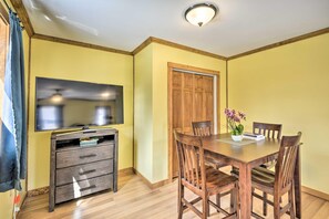 Sit down for dinner and a movie in this Suite's formal dining table.