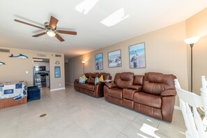 The great room and kitchen both have expansive views of the Gulf of Mexico