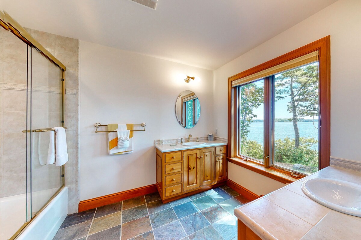 Delightful oceanfront home with amazing views, wrap-around deck & two fireplaces