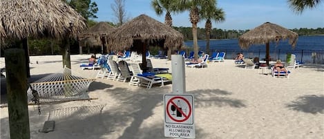 Resort beach with hammocks and loungers with view of Old Davenport Lake