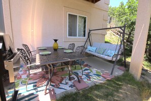 Patio Area, swing, table and grill