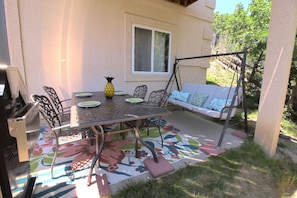 Patio Area, swing, table and grill