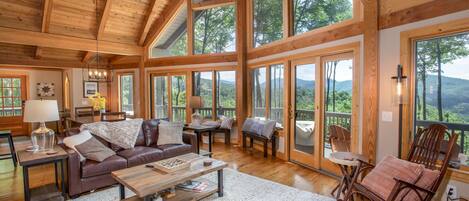 Huge Great Room with Soaring Vaulted Tongue-in-Groove Ceilings, Exposed Beams, and Wood Floors