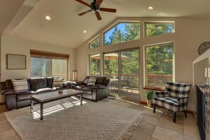 Living area with contemporary furniture, flat screen tv, and fireplace