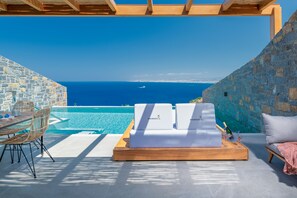 Enjoy the stunning views of the Aegean Sea from the comfort of your day bed!