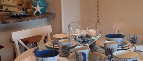 Cute beach dishes for enjoyable dining!
High top table seats 4.