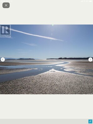 Typical day at the beach with the tide out. Enjoy the lukewarm tidal pools. 