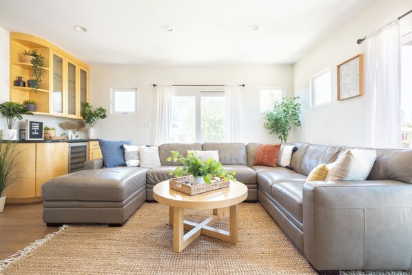 Relax and unwind  in the bright, sun-filled living space