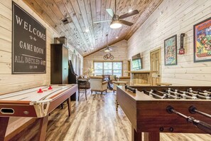 The kids will never want to leave! Game Room has air hockey, foosball tables, and 75" Roku TV.