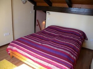 Sleeping area. Bedroom with comfortable bed with thick latex mattress