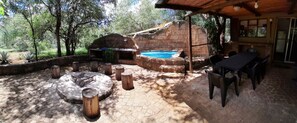 Wide view of Cottage Outside Area with Swimming Pool, BBQ Boma & Parkland View