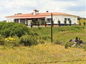 Casa Aguia (right) and Casa Coruja surrounded by wild flowers in Spring