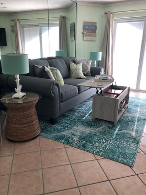 living room with work station built into the coffee table