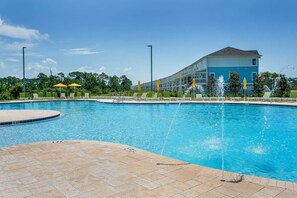 Complimentary chairs and umbrellas are available at the community pool